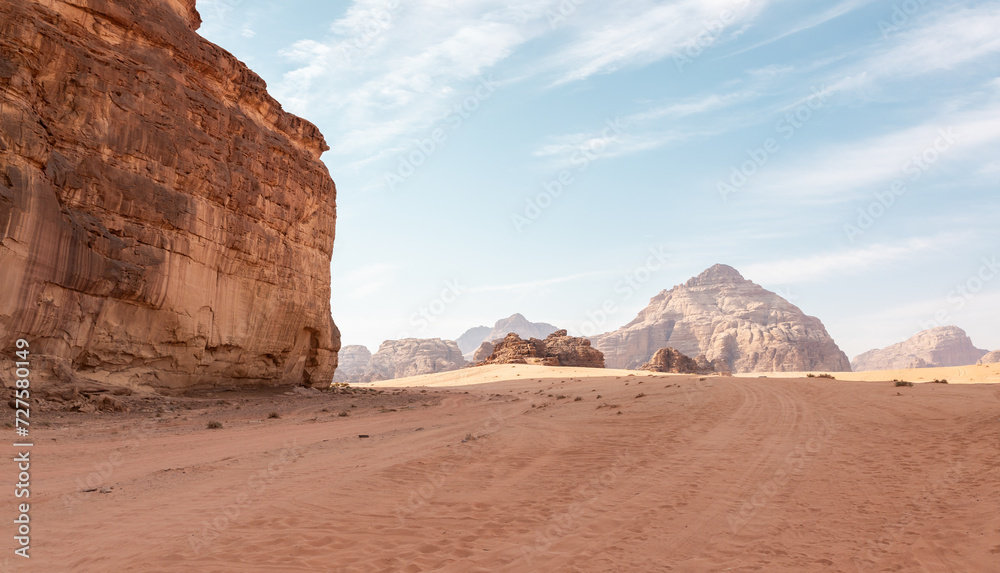 Unique beauty of high mountains in endless sandy red desert of the Wadi Rum near Amman in Jordan