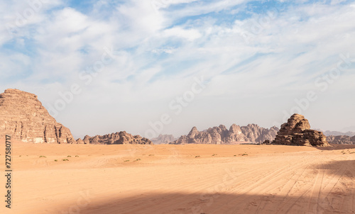 The unearthly beauty of the vast expanse of the endless sandy red desert of the Wadi Rum near Amman in Jordan