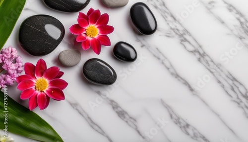 A marble countertop with rocks and flowers on it