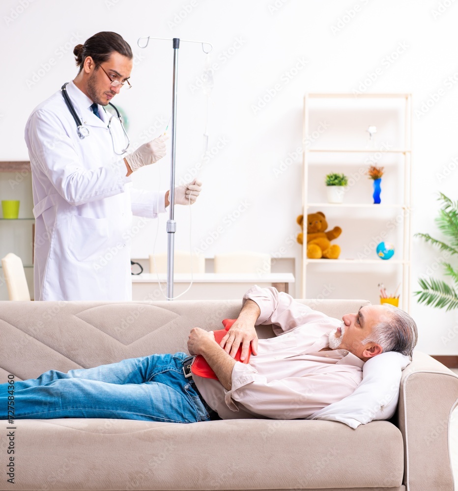 Young male doctor visiting old patient at home Young male doctor visiting old patient at home