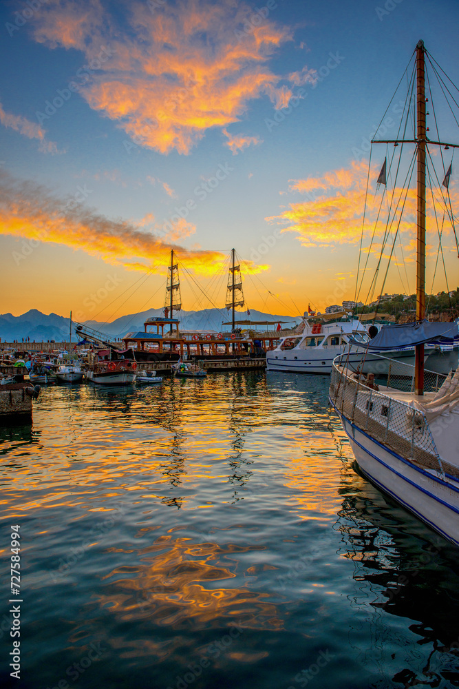 Fototapeta premium Panoramic view of harbor in Antalya Kaleici Old Town. Port and boats . Antalya, Turkey
