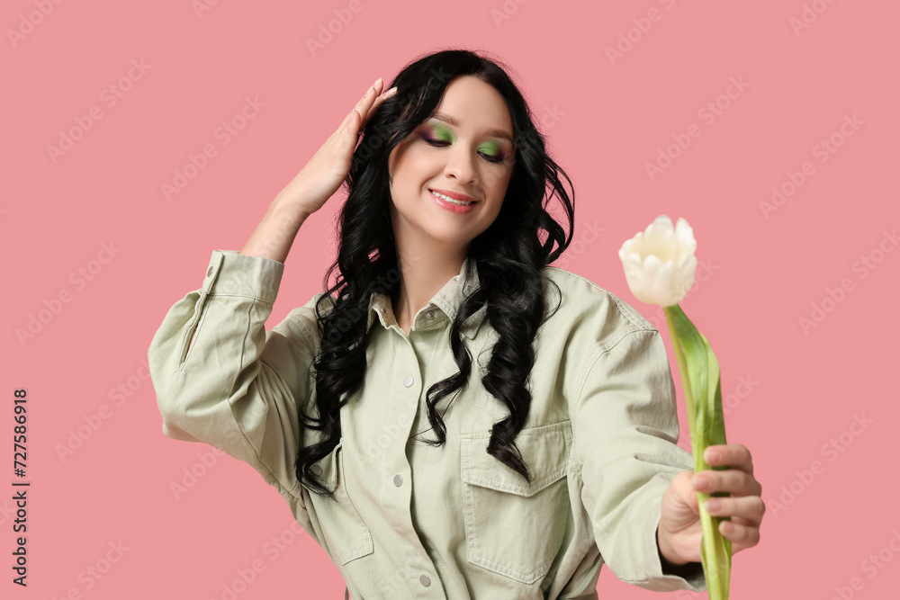 Beautiful young woman with white tulip on pink background. International Women's Day Beautiful young woman with white tulip on pink background. International Women's Day