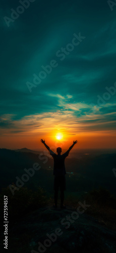 Silhouette of a Man Celebrating Success While Hiking at Sunset