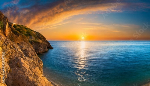 sunset over the sea, calm ocean at dawn or sunset. Panoramic banner of a peaceful landscape © Bilal