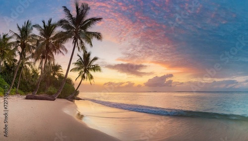 sunset on the beach  Paradise beach with palm trees and calm ocean at dawn or sunset. Panoramic banner of a peaceful landscape