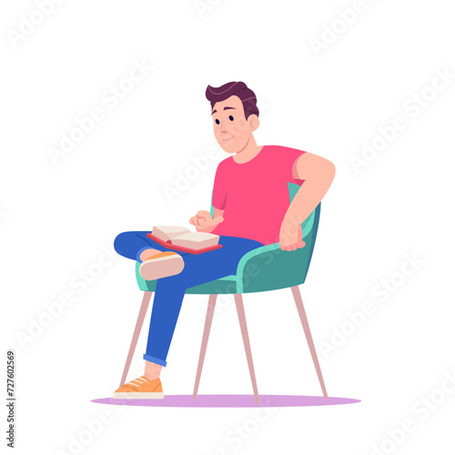 Young man isitting on a chair and reading a book.