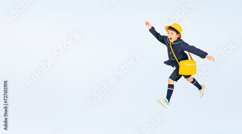 ジャンプする幼稚園児・保育園児の男の子（切り抜き背景透過PNGも販売しております。作成者リンクから「PNG」で検索してください） photo