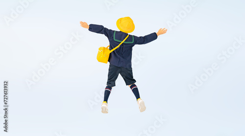 ジャンプする幼稚園児・保育園児の男の子の後ろ姿（切り抜き背景透過PNGも販売しております。作成者リンクから「PNG」で検索してください） photo