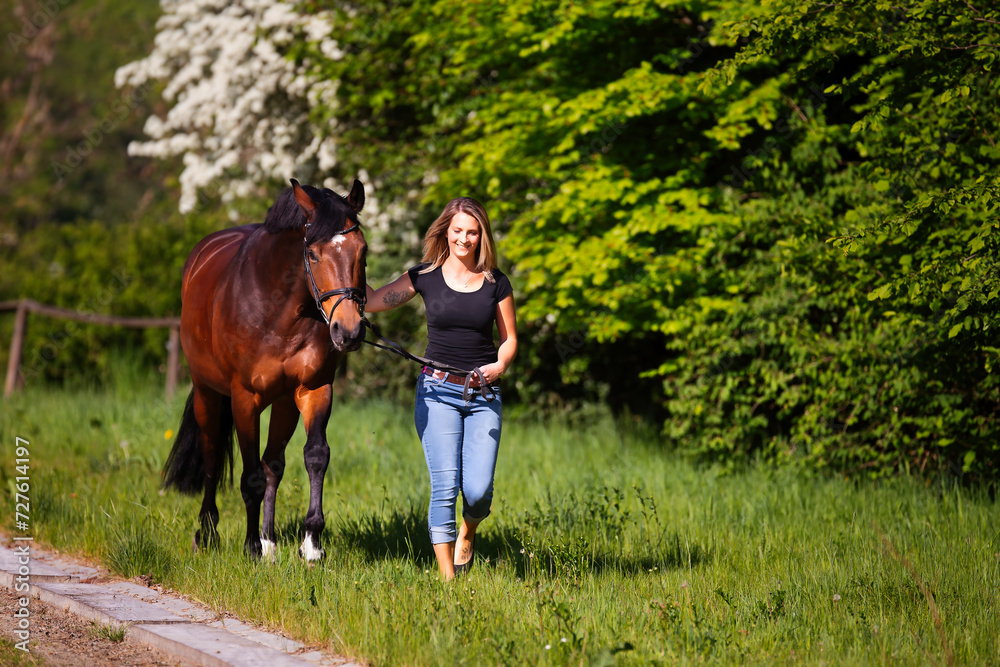 Young woman with horse in spring in nature. Young woman with horse in spring in nature.