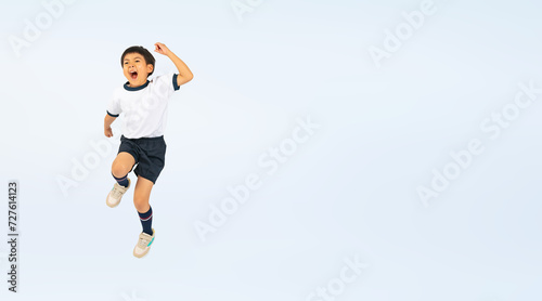 ジャンプする体操服を着た男の子（切り抜き背景透過PNGも販売しております。作成者リンクから「PNG」で検索してください） © metamorworks