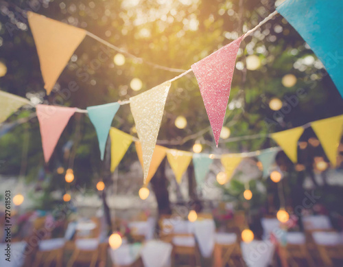 Blur background colorful triangular flags of decorated celebrate outdoor party, vintage tone.