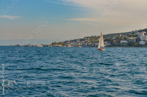 Burgazada island and harbor scenic view from Istanbul ferry boat (Adalar, Turkey) photo