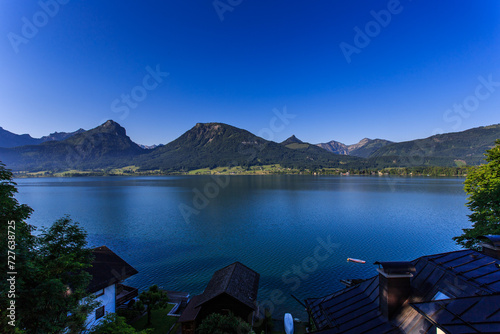 Beautiful view on Sankt Wolfgang im Salzkammergut on alps mountains, lake Wolfgangsee, blue sky. Austria, Salzburg