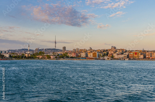 sunset view of Haydarpasa harbor and district from Bosporus (Istanbul, Turkey)   photo