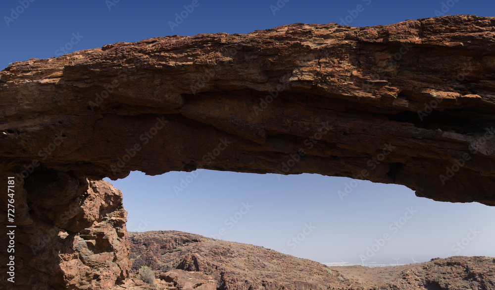 Spectacular vertical walls of Barranco Hondo, Deep Ravine, Gran Canaria, Canary Islands, rock Arch arco del Coronadero