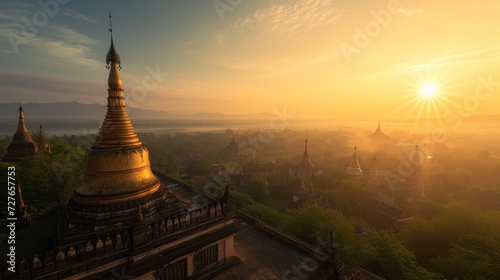 At the tip of the pagoda in the land of Burma  the sun sets with beautiful light. Beautiful view as far as the eye can see  high angle