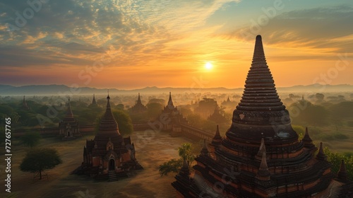 At the tip of the pagoda in the land of Burma  the sun sets with beautiful light. Beautiful view as far as the eye can see  high angle