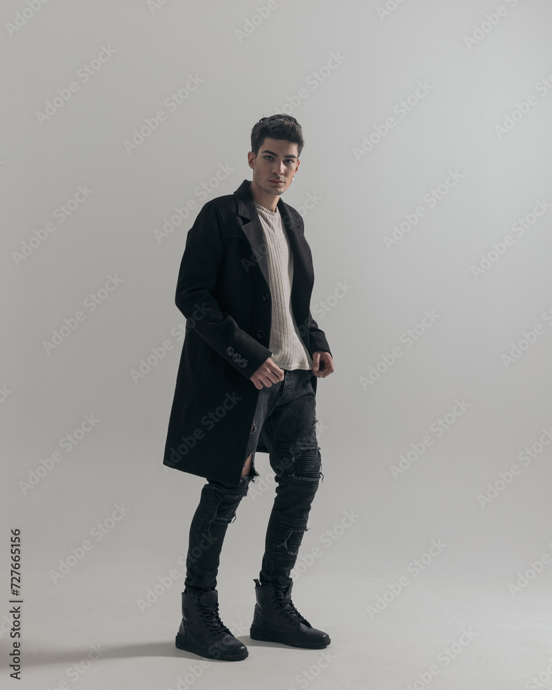 handsome young man wearing black overcoat handsome young man wearing black overcoat
