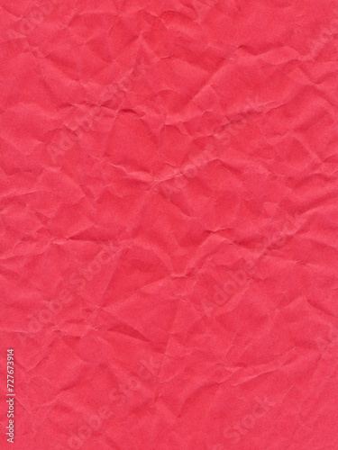 Texture of colored paper, sheet of crumpled dark red paper