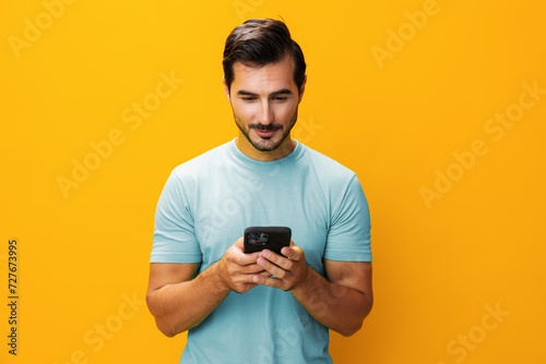 Man smiling smartphone yellow portrait phone cyberspace communication studio happy phone copy mobile space © SHOTPRIME STUDIO