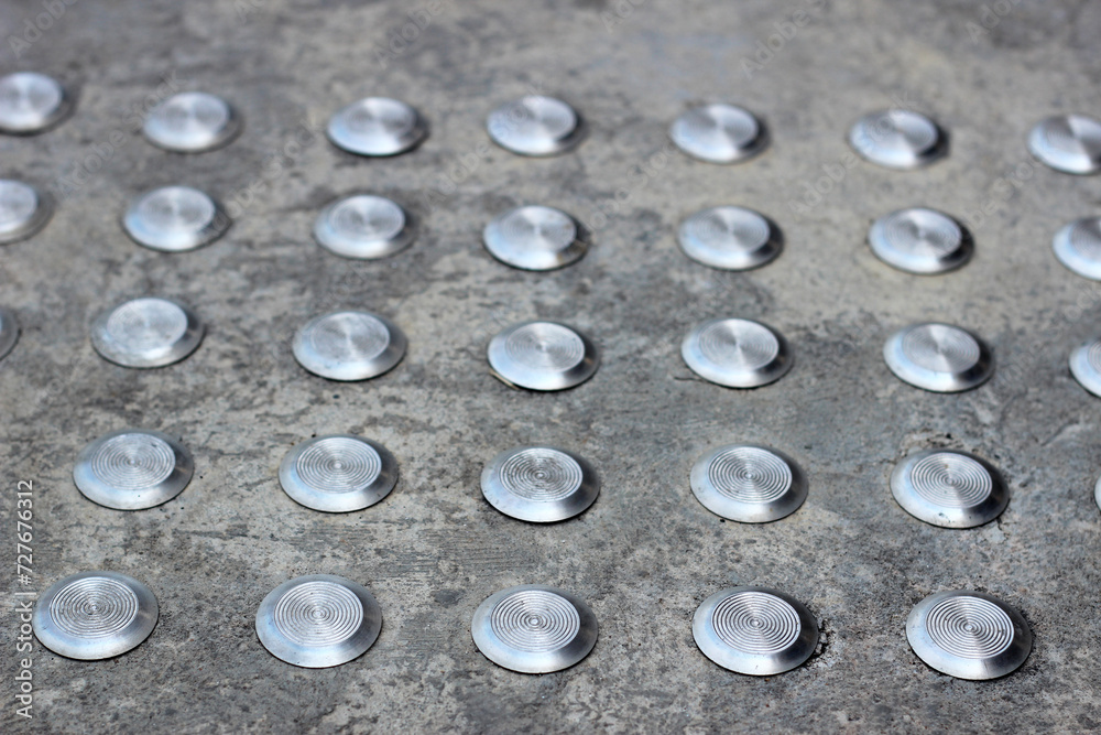 Cement fllor with tactile ground surface indicators Cement fllor with tactile ground surface indicators