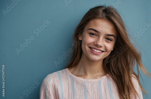 studio fashion portrait of a smiling young woman