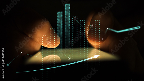 Tableau sur toile Motion of graphs and charts on the background of hands using smartphone