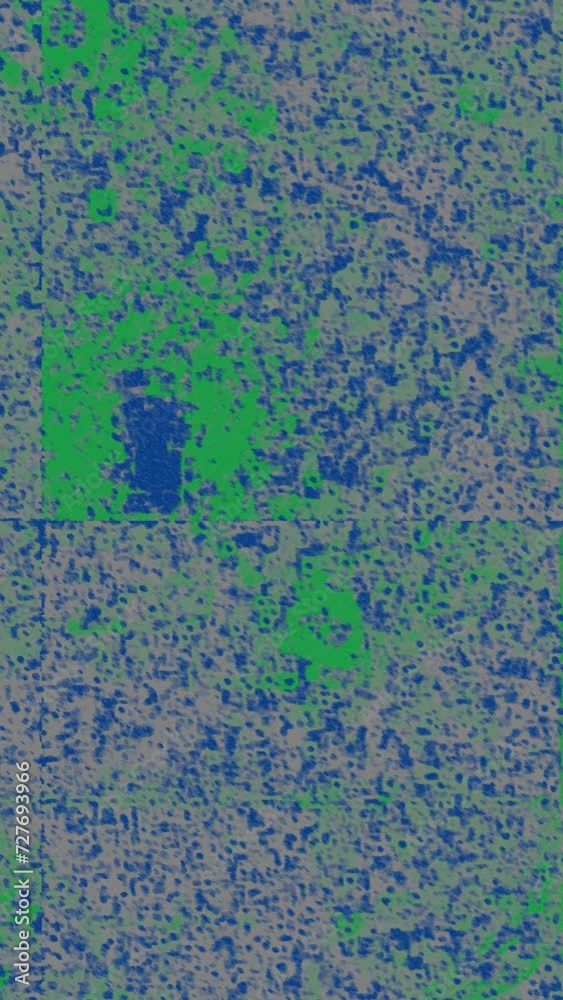 An abstract grunge texture vertical motion graphic background. An abstract grunge texture vertical motion graphic background.