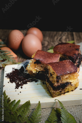 Chocolate sweet Indonesian thick-folded crepe or Martabak manis/Terang Bulan food photography with tropical leaves