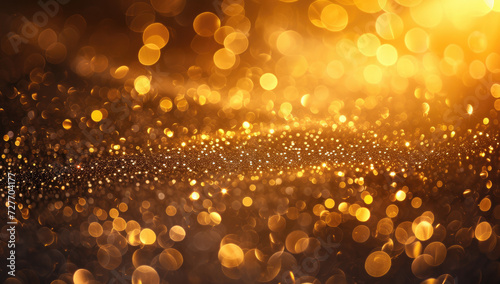 Golden particles and glimmers create a festive atmosphere for celebrations like Christmas or New Year. The radiant golden lights make for an ideal wallpaper background suitable for gift wraps