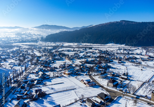 Aerial view of Moldovita village in Suceava county - Romania in winter photo