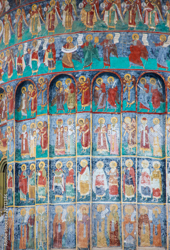 Biblical scenes and icons on the wall of the Moldovita monastery - Romania © sebi_2569