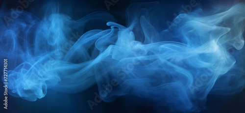 abstract blue smokey effect against black background.