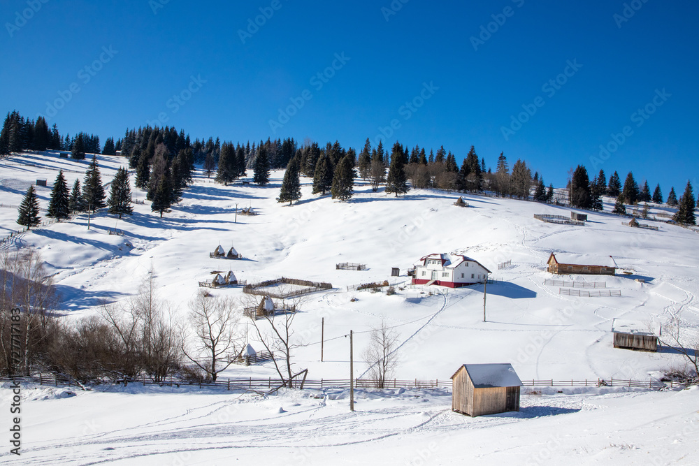 A beautiful landscape with an isolated peasant farm in the Romanian mountain area in winter A beautiful landscape with an isolated peasant farm in the Romanian mountain area in winter