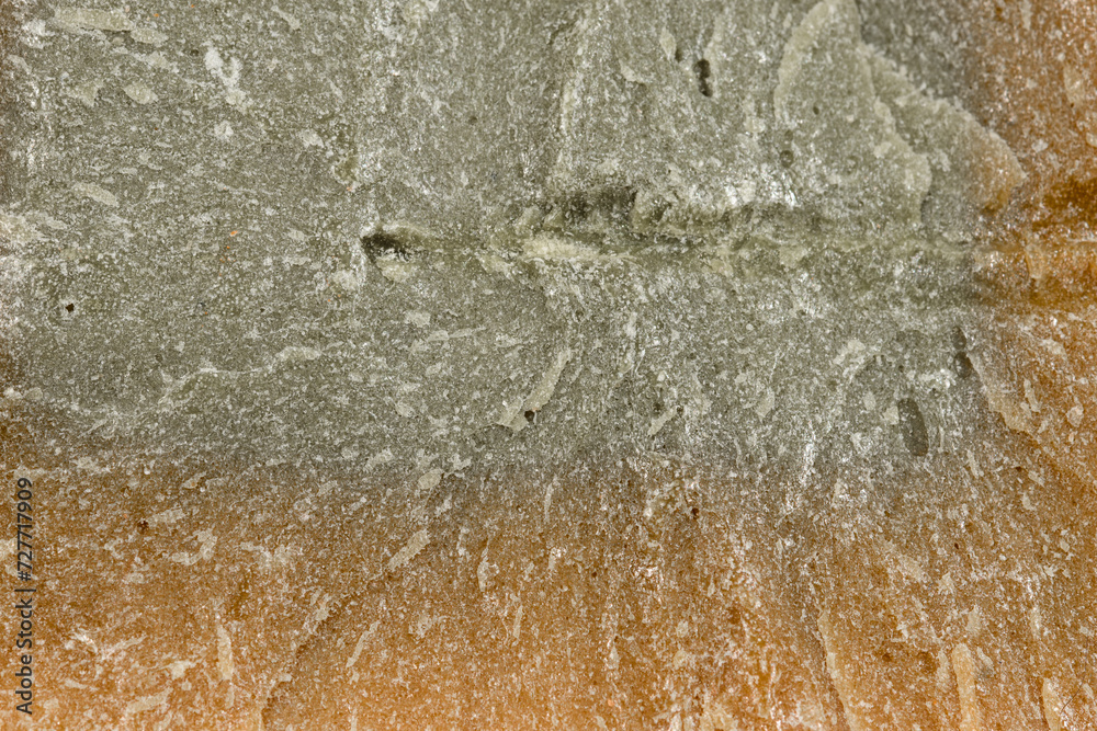 Obraz premium Struktura retro szarego mydła z bliska, przypominająca popękany stary beton 