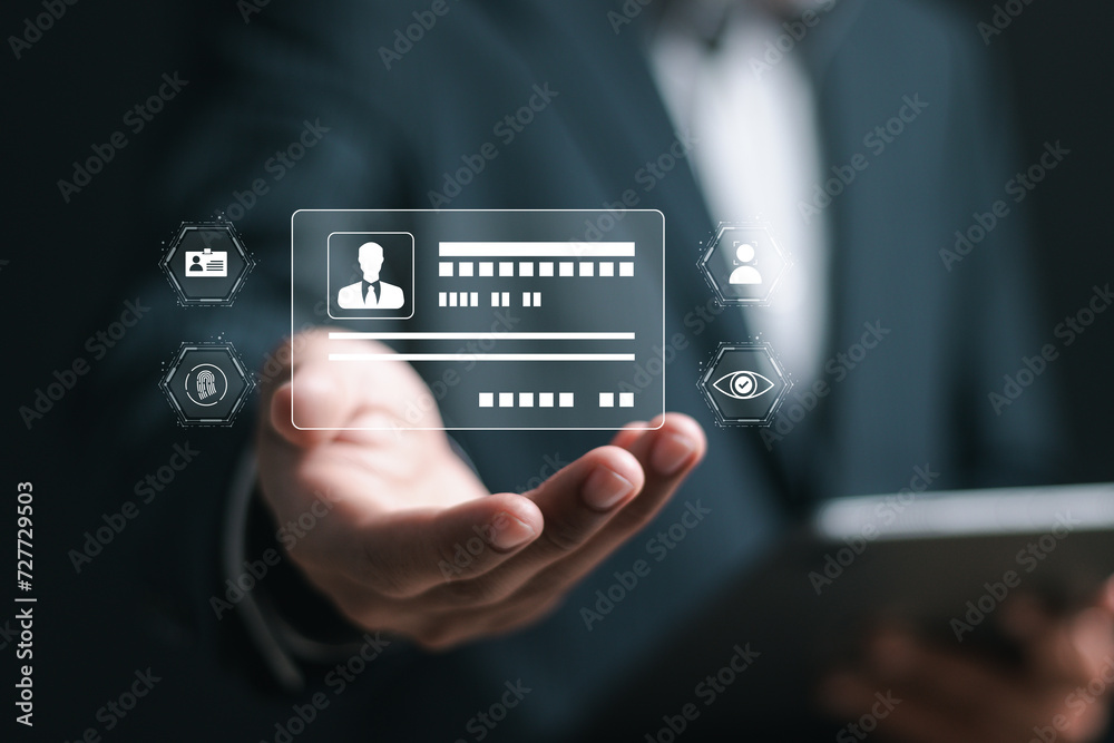 © Pakin - Digital identification or digital ID concept. Businessman show virtual screen of digital identification card to accessing databases by digital identity for cyber security.
