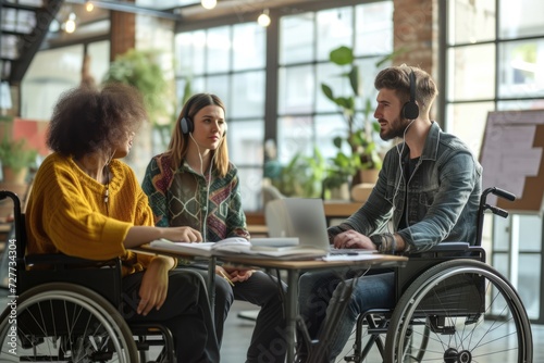 Two mid adult women disagree about the solution to the problem while a man in the wheelchair uses earphones to focus on his work