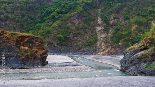 Strong stream in deep valley.gurgling pour water.Charming Valley,textured rock form a spectacular scenic scene view.High quality video. Maolin District, Kaohsiung City, Taiwan.Real time. 4K. photo