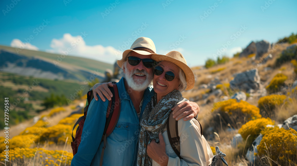 man and woman senior couple  in the mountains