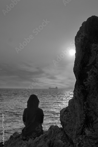 Silhouette lonely woman at beach no Face back view.