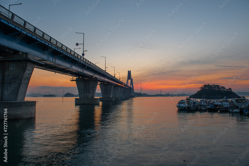 Bridge over the sea and scenery at dawn
