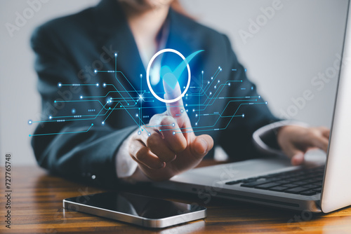 Service guarantee, validation certificate concept for business process automation, quality assurance management, approved, digital evaluation. Business woman touching checked icon on virtual screen.