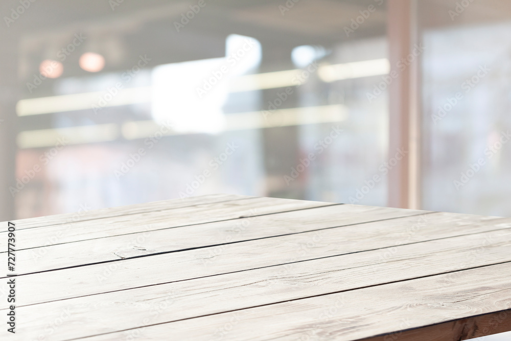 Empty wooden table top on window blur and abstract with sunlight. For mounting product display or visual Empty wooden table top on window blur and abstract with sunlight. For mounting product display or visual