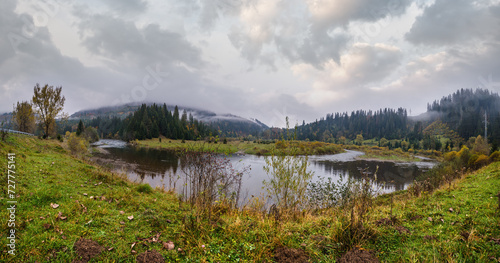 Foggy and overcast autumn day in Carpathian Mountains. Rika river bend, Transcarpathia, Ukraine.