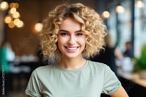 Golden Gleam: captivating woman with lustrous blonde locks joyfully directs her smile into the camera lens.