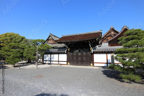 Shoin Gate in Nishi Hongwanji Temple, Kyoto, Japan (Japanese words on the stone statue mean "Hongwanji Temple, the place where Emperor Meiji visited")