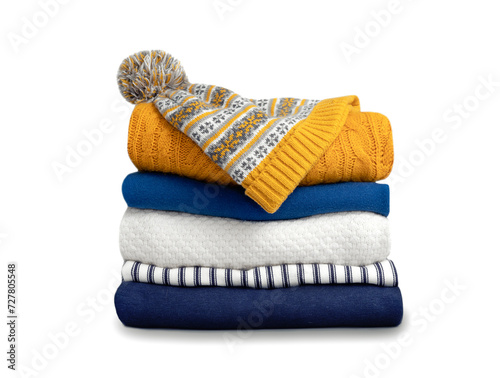 Stack of colorful knitted folded clothes isolated on white. Winter apparel,yellow blue knitwear.