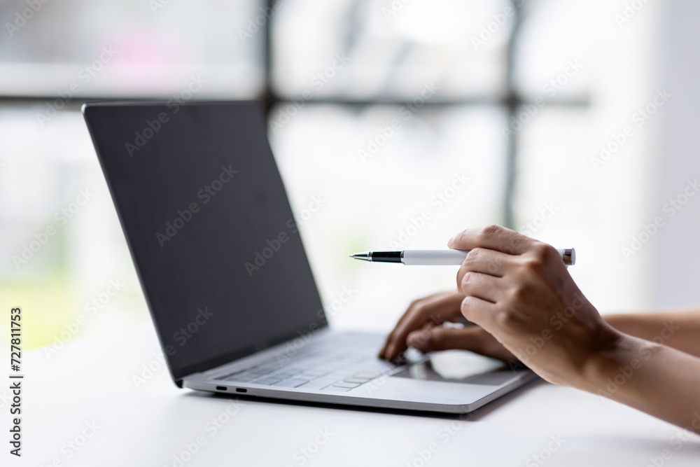 business hand use laptop to working about growth finance report of new startup project.
