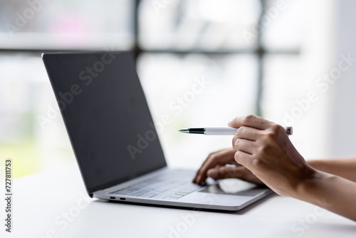 business hand use laptop to working about growth finance report of new startup project. 