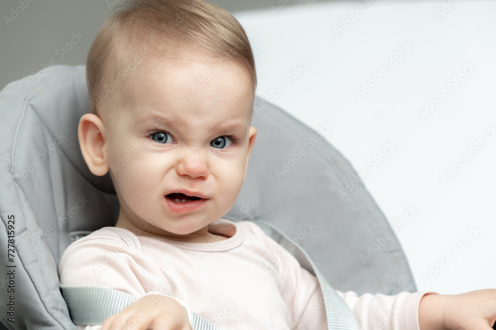 Portrait of crying toddler baby upset of being hungry and tired